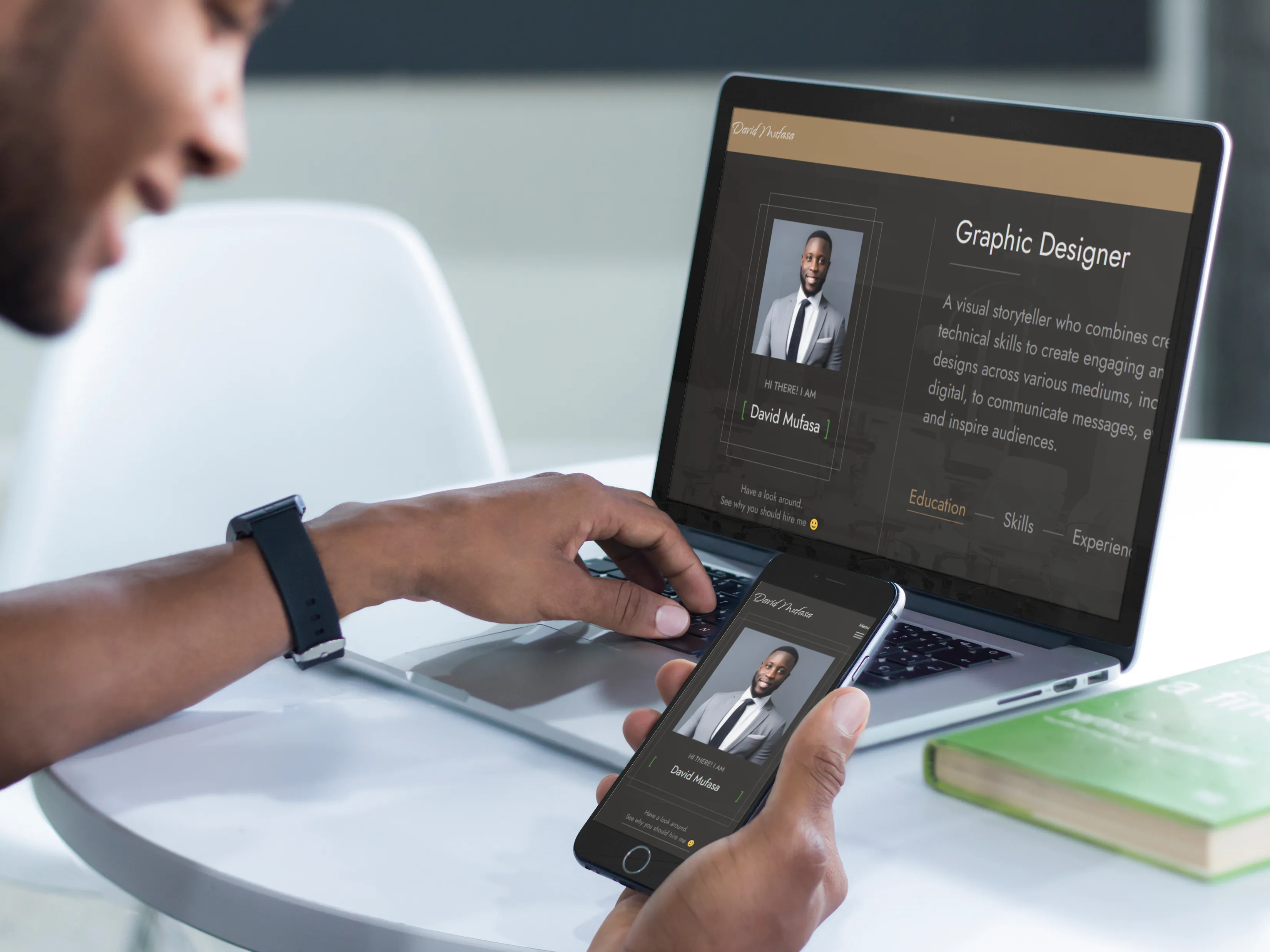 SME owner looking at his s254 website on macbook pro laptop and iphone 6